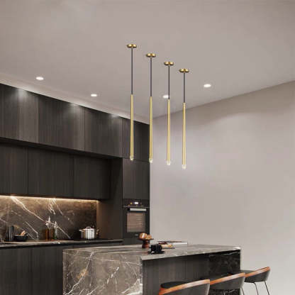 Modern Carr gold pendant lights over kitchen island.