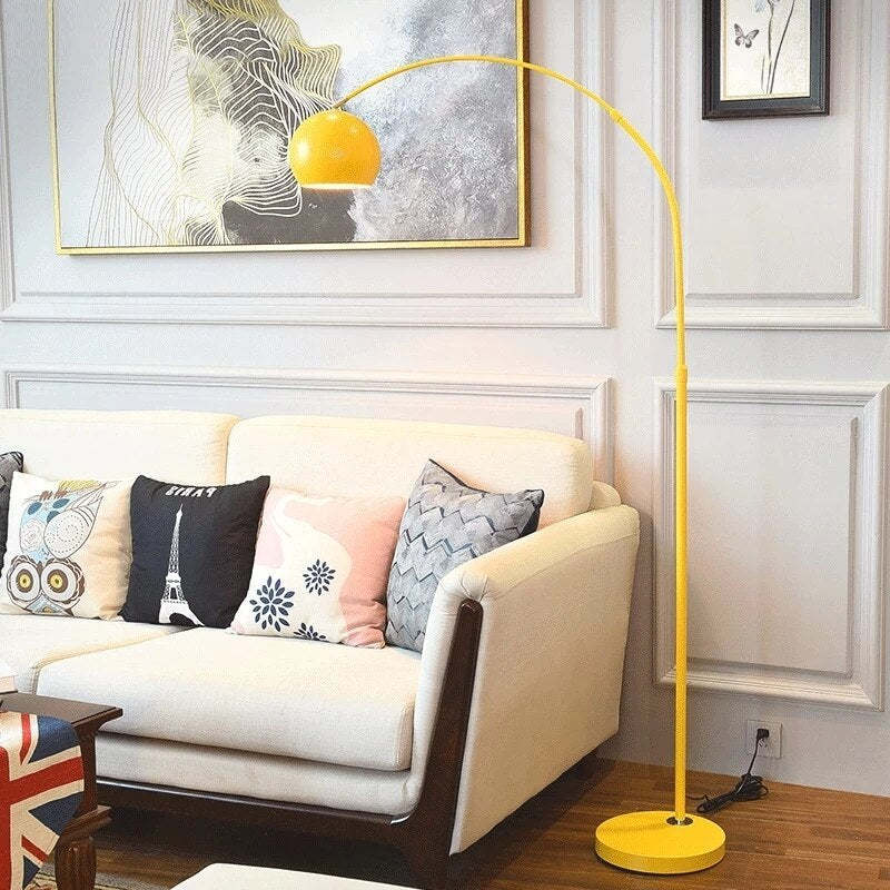 Yellow Morandi arc floor lamp in living room. Las Sola lighting solutions. Morandi Modern Fishing 1 Light Arc Floor Lamp Metal