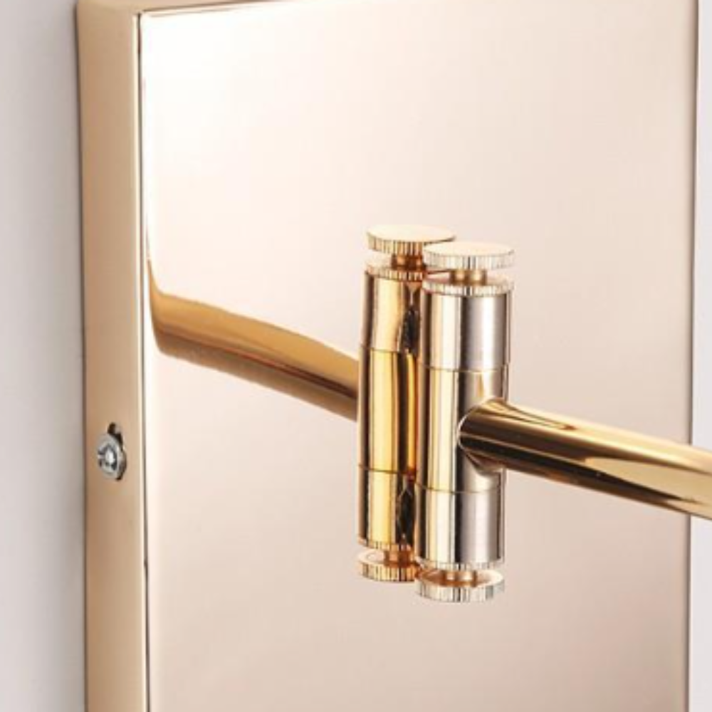 Brady Gold Wall Lamp: Adjustable metal arm detail.