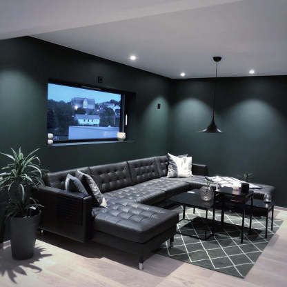 Cairns pendant light in modern dark green living room
