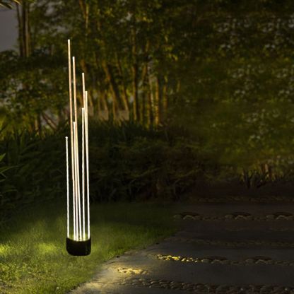 Riley Optical Fiber LED Ground Light illuminating a garden pathway at night