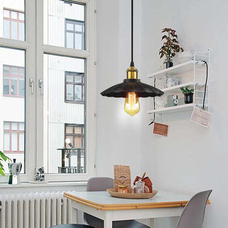 Alessio pendant light over dining table. Modern industrial lighting.