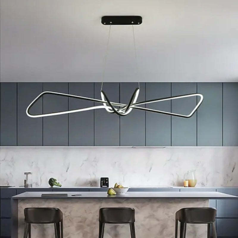 Minimalist metal pendant light for modern kitchens.