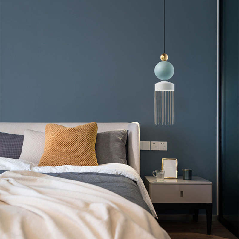 Colon tassel pendant light in modern bedroom setting