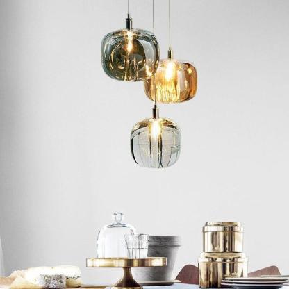 Hailie bubble glass pendant lighting over dining table.