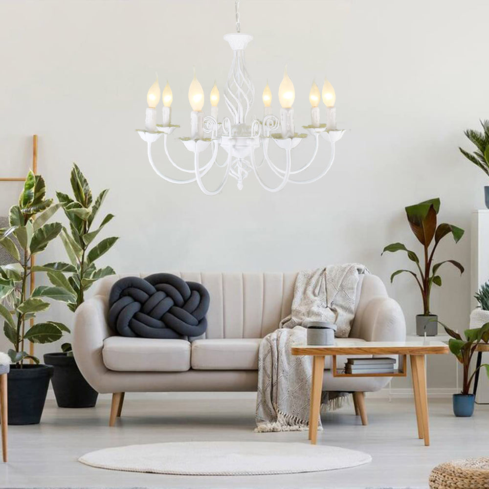 White Silva chandelier above a modern living room sofa