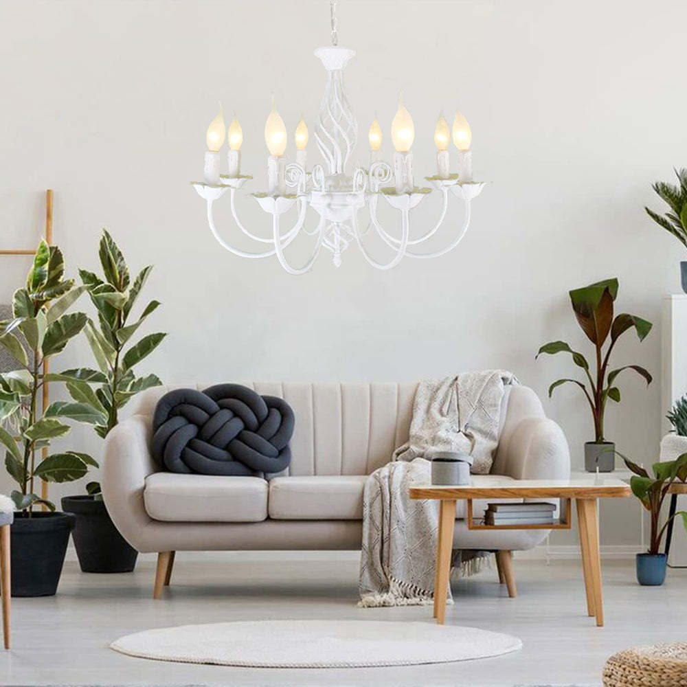 White Silva chandelier above a modern living room sofa