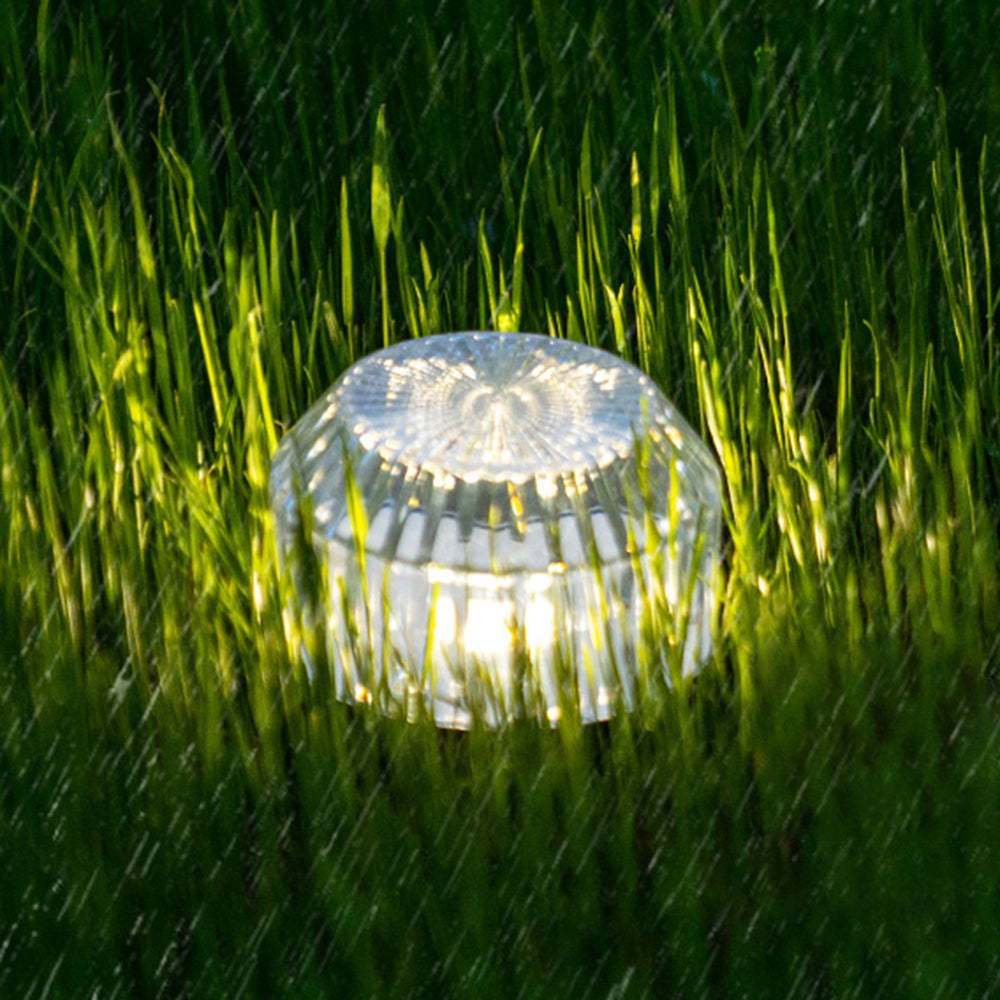 Orr solar LED table lamp in grass