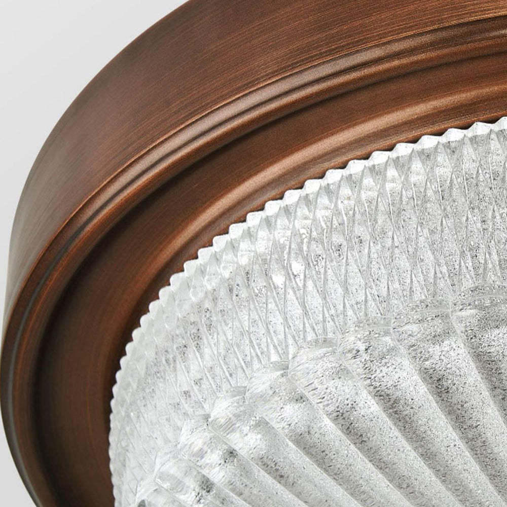 Close-up of Alessio vintage flush mount light glass detail.