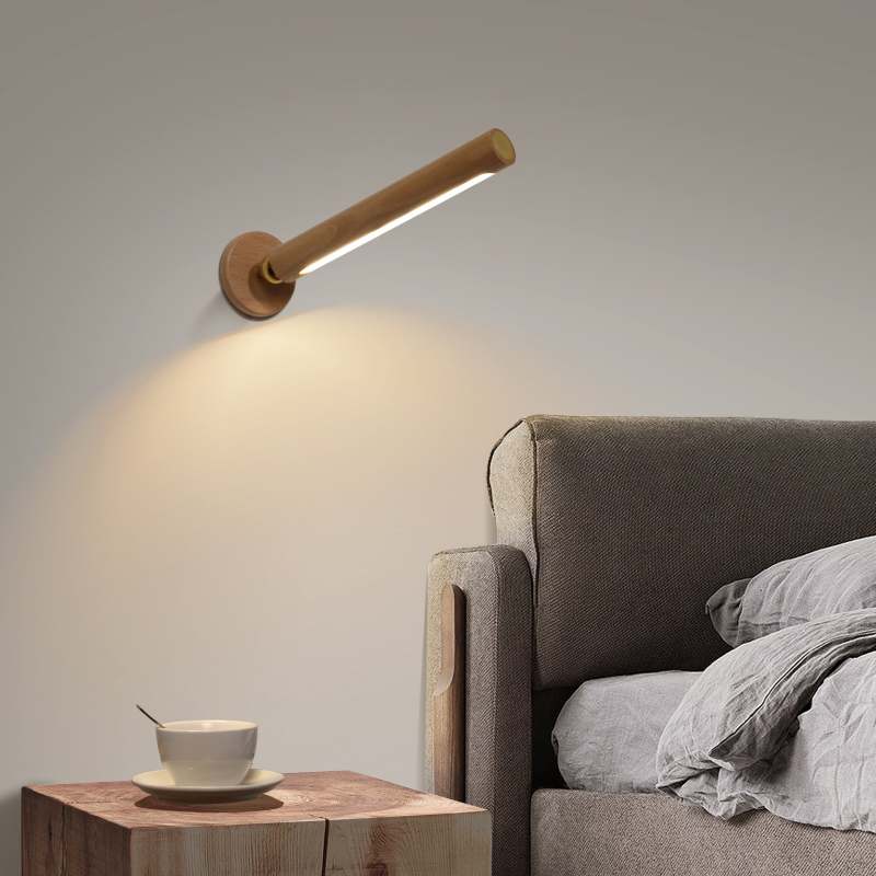 Ozawa wooden wall lamp shines in bedroom setting.