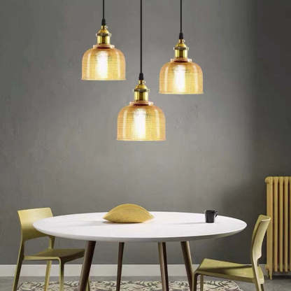 Amber glass Art Deco pendant lighting over dining table