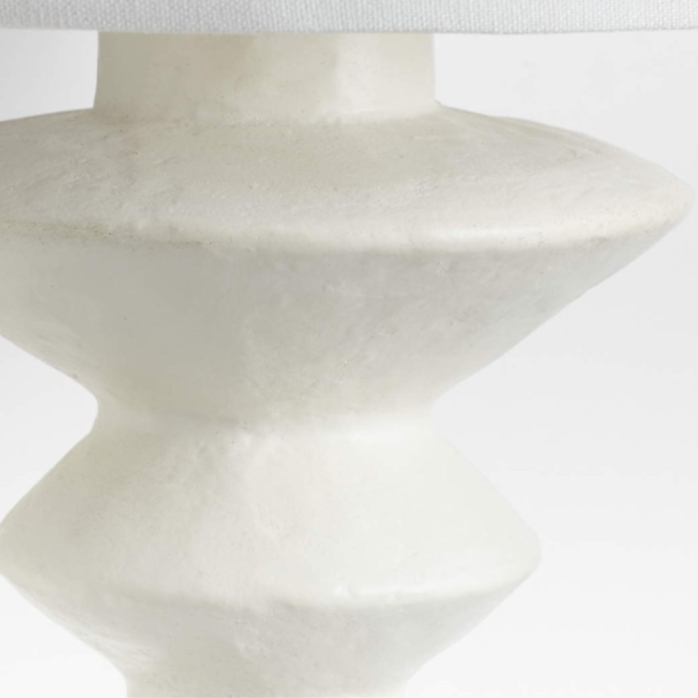 Alessio white resin wall lamp base close-up.