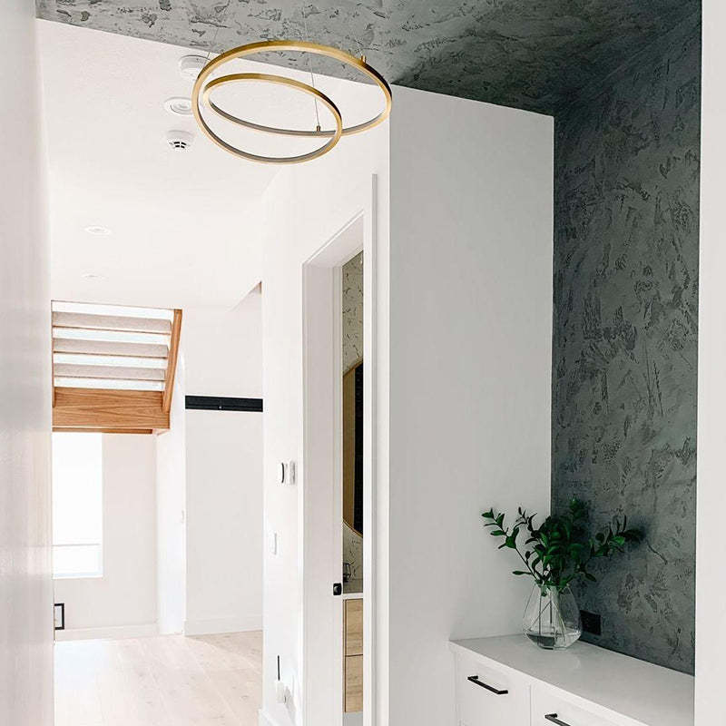 Arisha brass circle pendant light in modern hallway. Las Sola lighting.