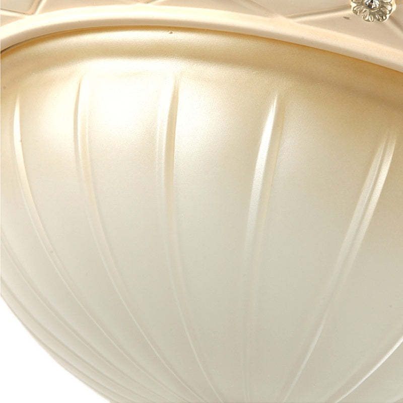 Cream Alessio flush mount ceiling light texture close-up.