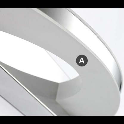 Leigh chrome wall lamp detail. Modern bathroom lighting fixture.