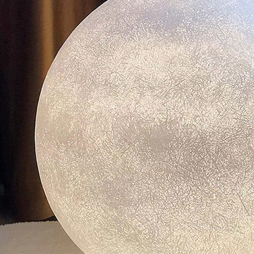 Close-up of Elif Moon Globe Floor Lamp's resin shade.