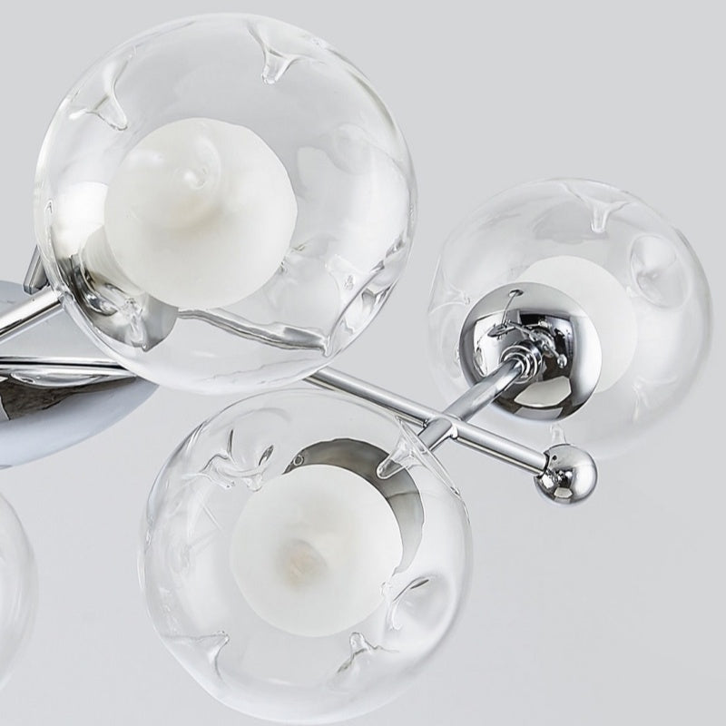 Close-up detail of Valentina chandelier glass globes and chrome finish