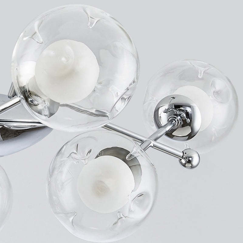 Close-up detail of Valentina chandelier glass globes and chrome finish