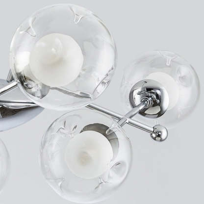 Close-up detail of Valentina chandelier glass globes and chrome finish