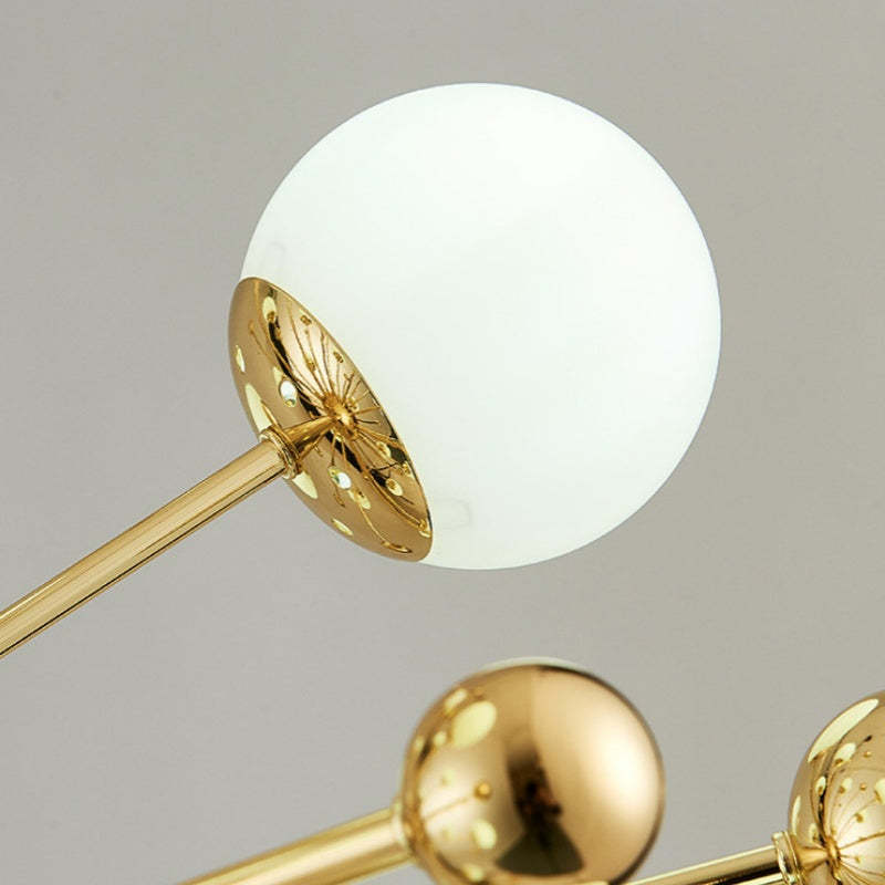Alessio gold LED chandelier. Close up modern lighting fixture.
