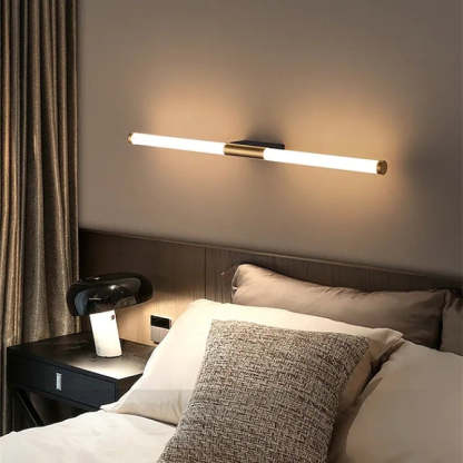 Modern linear LED wall lamp in bedroom setting.