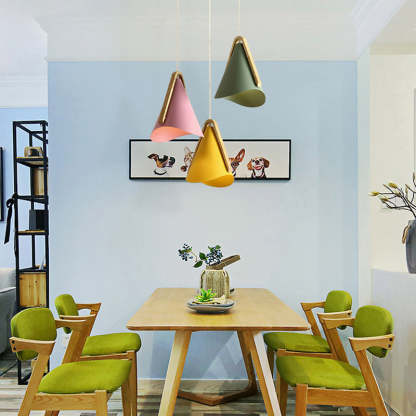 Morandi pendant lights in modern dining room. Cone lights.