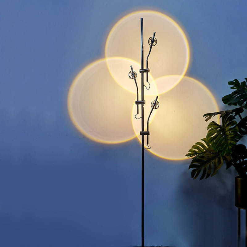 Salgado floor lamp projecting sunset light circles