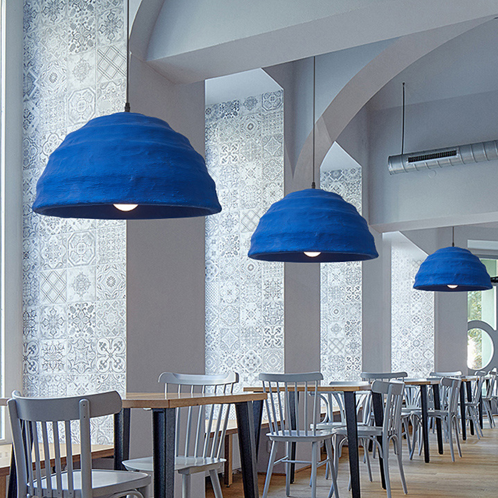 Blue Hailie pendant lights over dining tables
