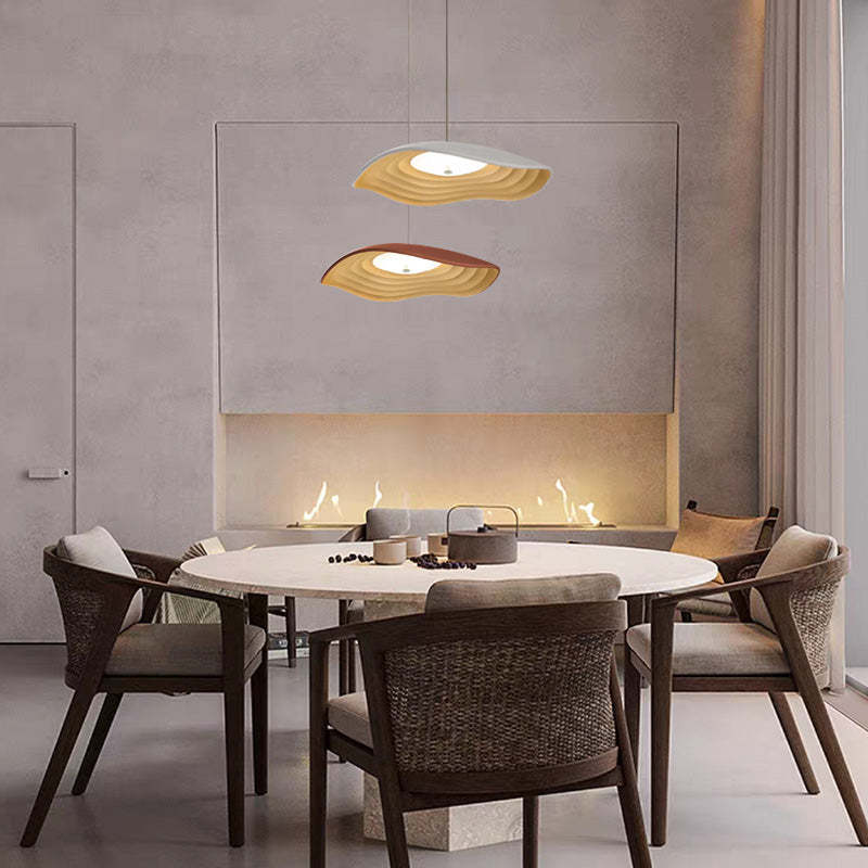 Wabi-Sabi Resin LED Pendant Lights above round dining table