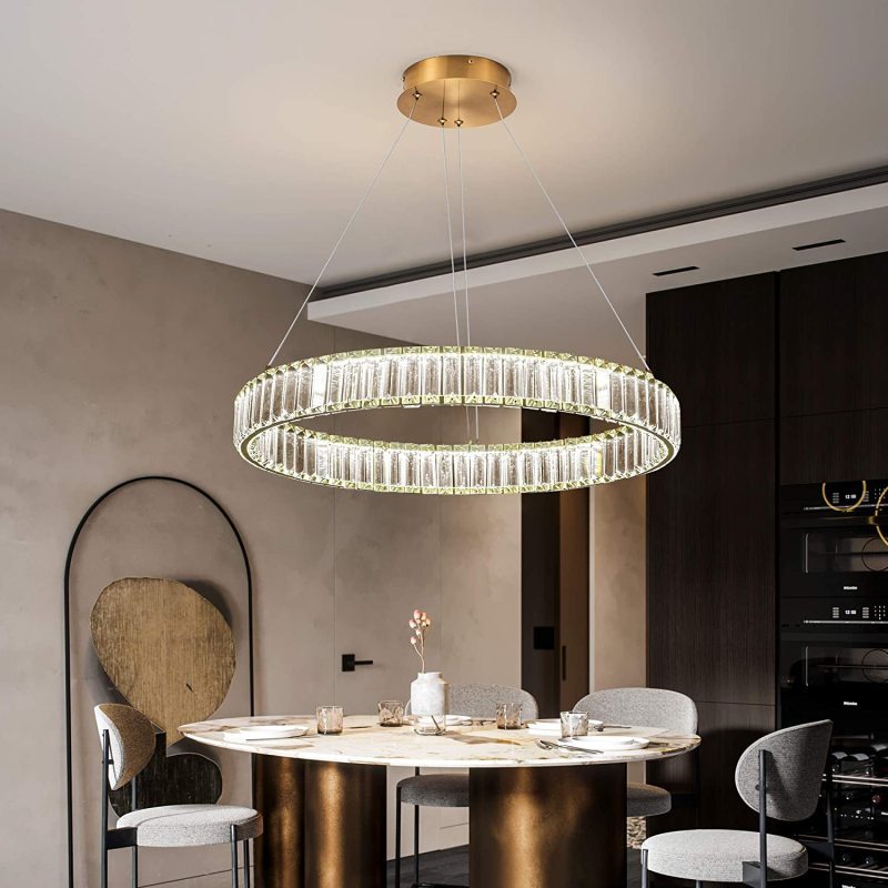 Round crystal chandelier over dining table
