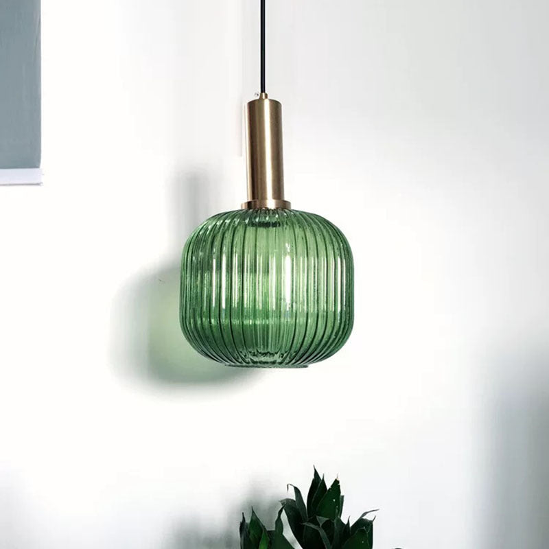 Green Hailie glass pendant light with brass fitting.