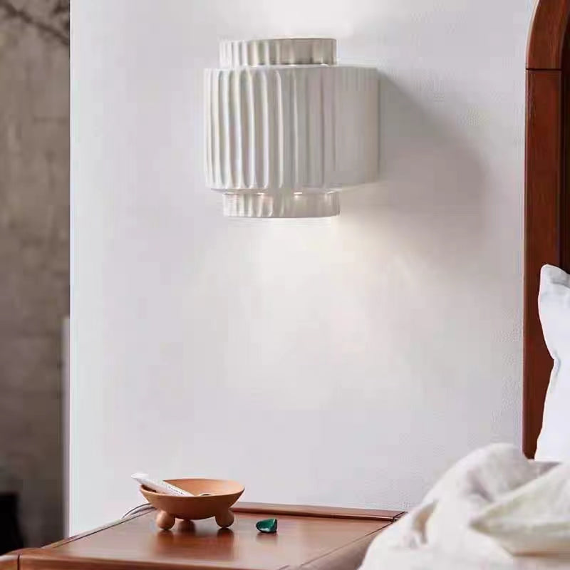Bedroom wall lamp illuminating bedside table, vintage style