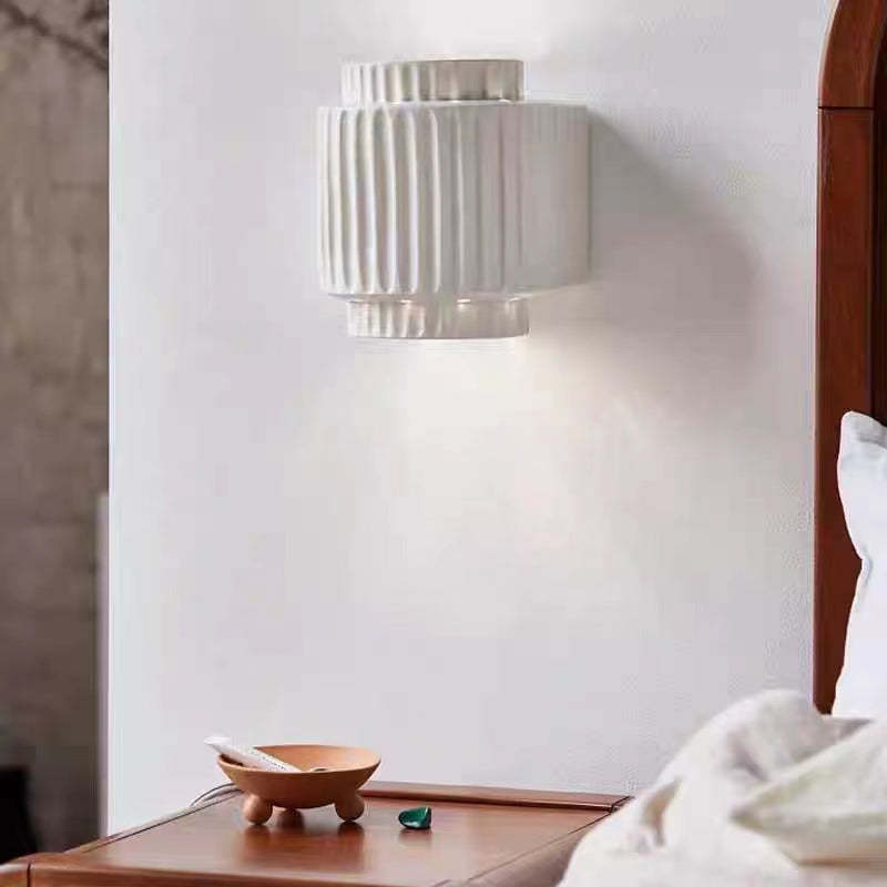 Bedroom wall lamp illuminating bedside table, vintage style