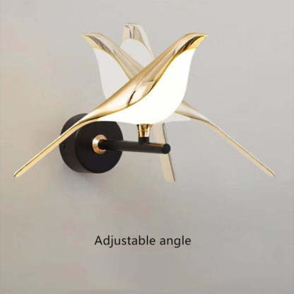 Clifford gold bird wall lamp with adjustable angle.