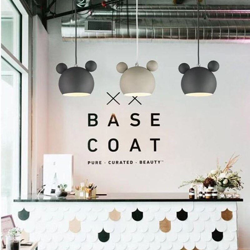 Las Sola: Cartoon beer pendant lights in store setting.