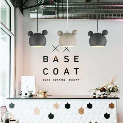 Las Sola: Cartoon beer pendant lights in store setting.