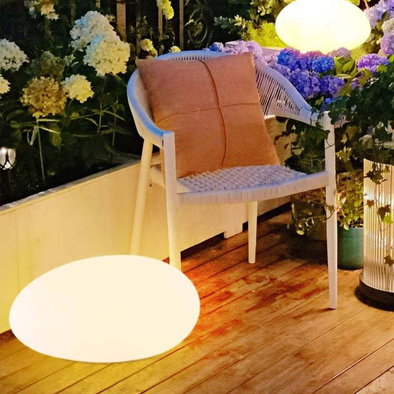 Stone shaped rechargeable outdoor light on patio Pena Modern Stone Shaped Rechargeable Outdoor Light