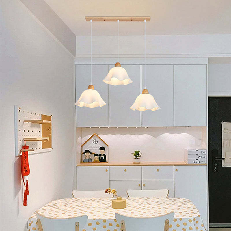 Dining room with Ozawa flower pendant lighting from Las Sola.