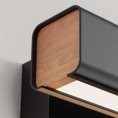 Close-up of Aqsa black metal & wood rotatable wall lamp.