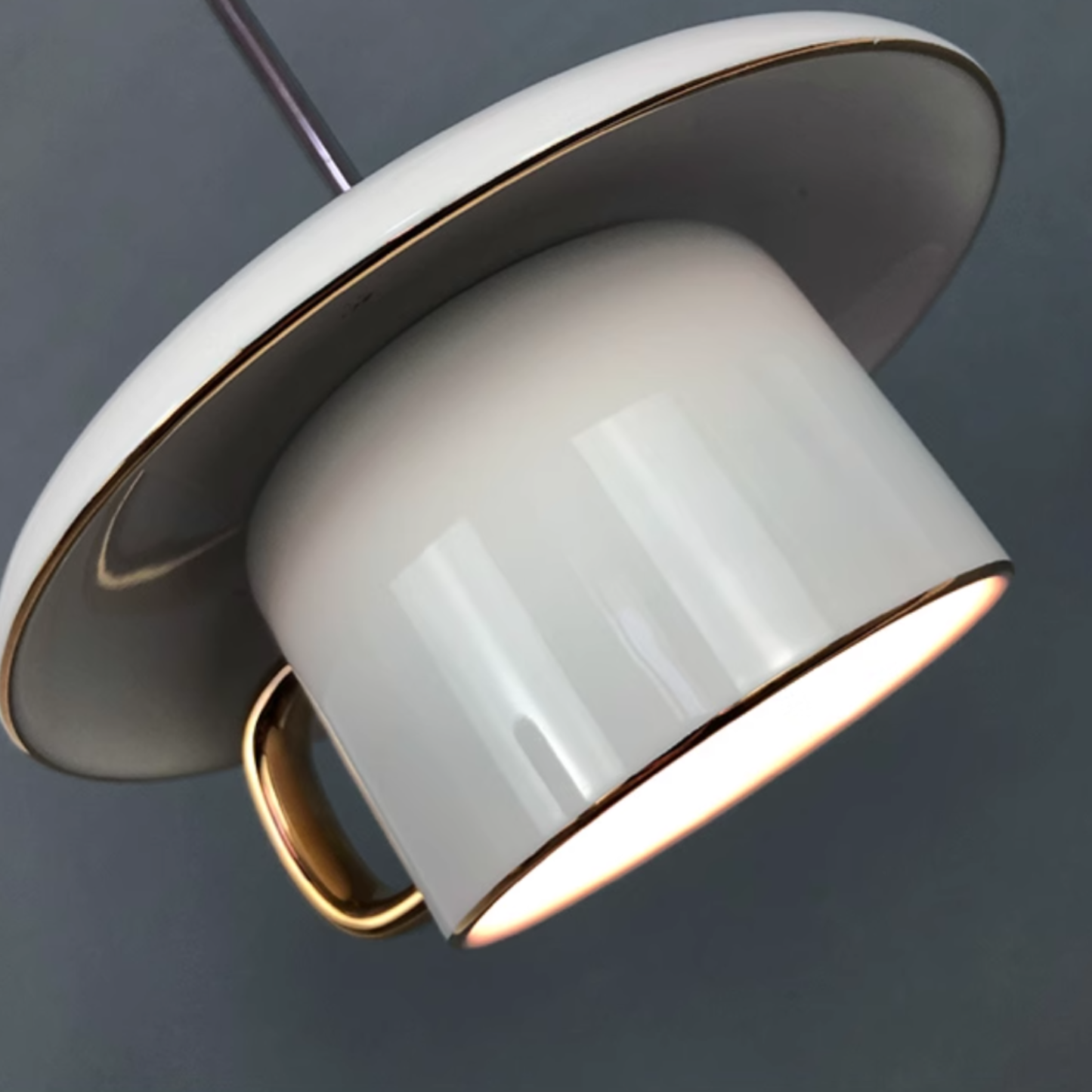 White ceramic pendant light with gold trim