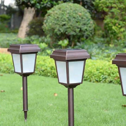 Coffee Pena solar bollard lights in garden