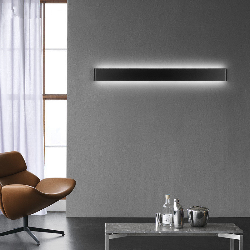 Modern black wall lamp in minimalist interior design