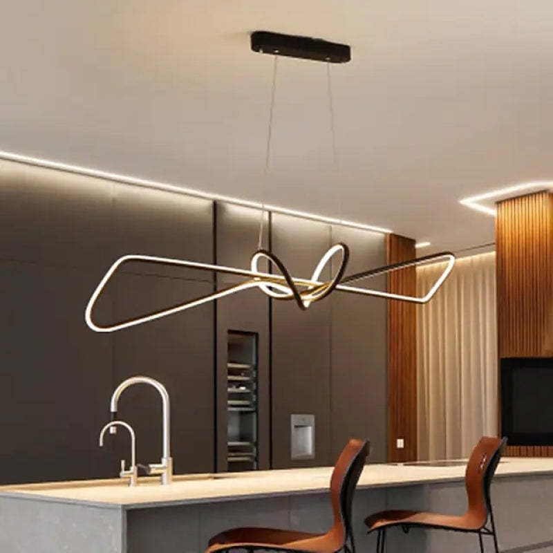 Modern kitchen with geometric metal pendant lighting.