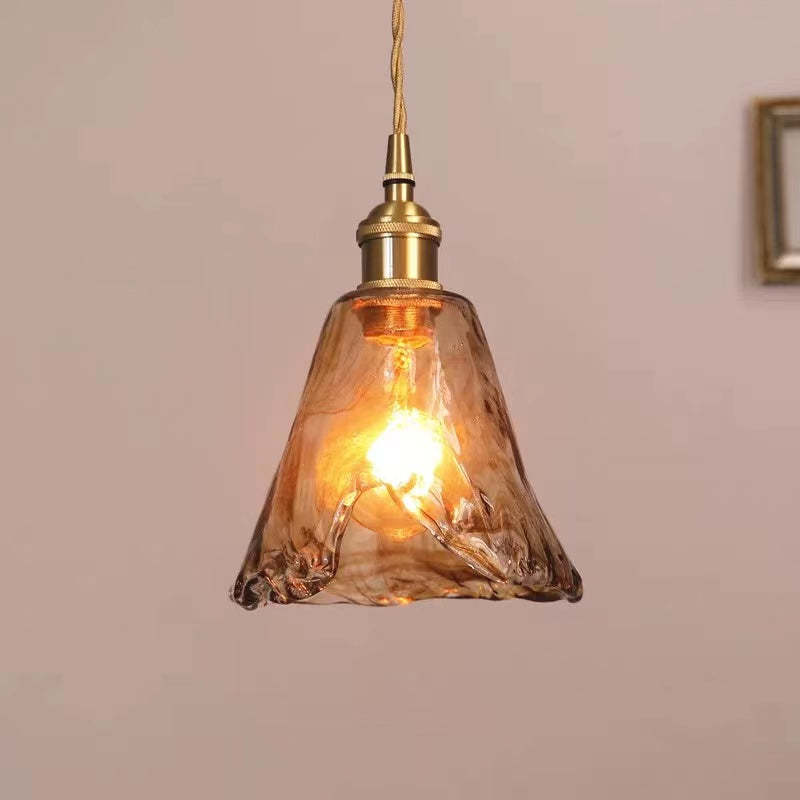 Levy caramel glass pendant light. Vintage style fixture.