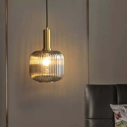 Hailie glass pendant light in bedroom setting.
