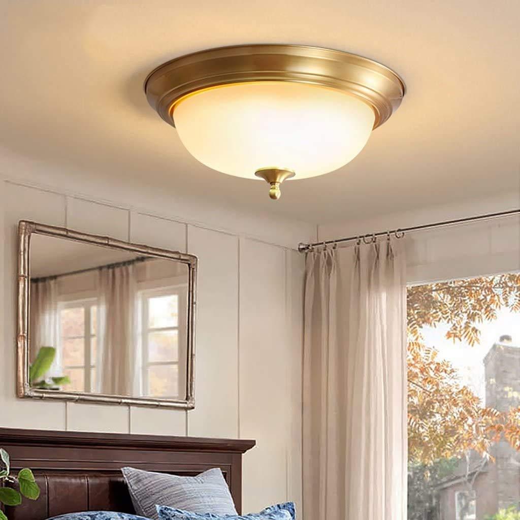 Brass flush mount ceiling light in bedroom, Alessio LED lighting