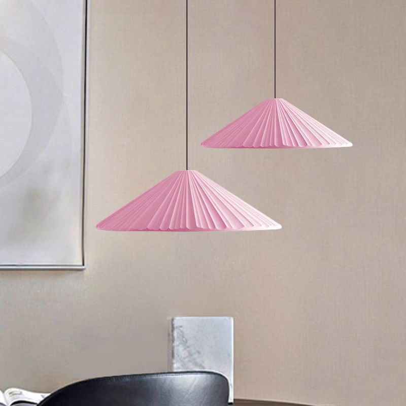 Las Sola: Pair of pink triangle pendant lights. Modern lighting.