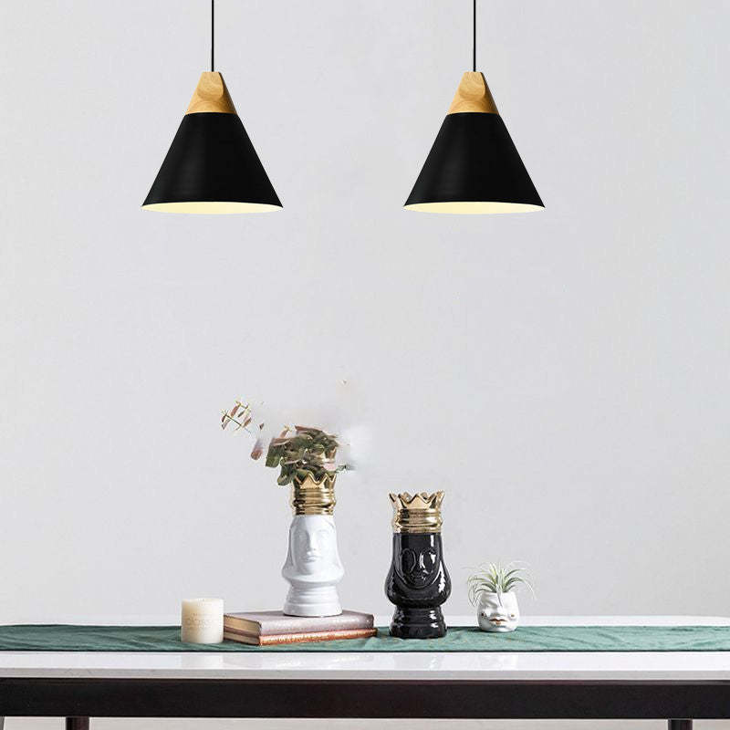 Black Morandi pendant lights over table, Lassola lighting