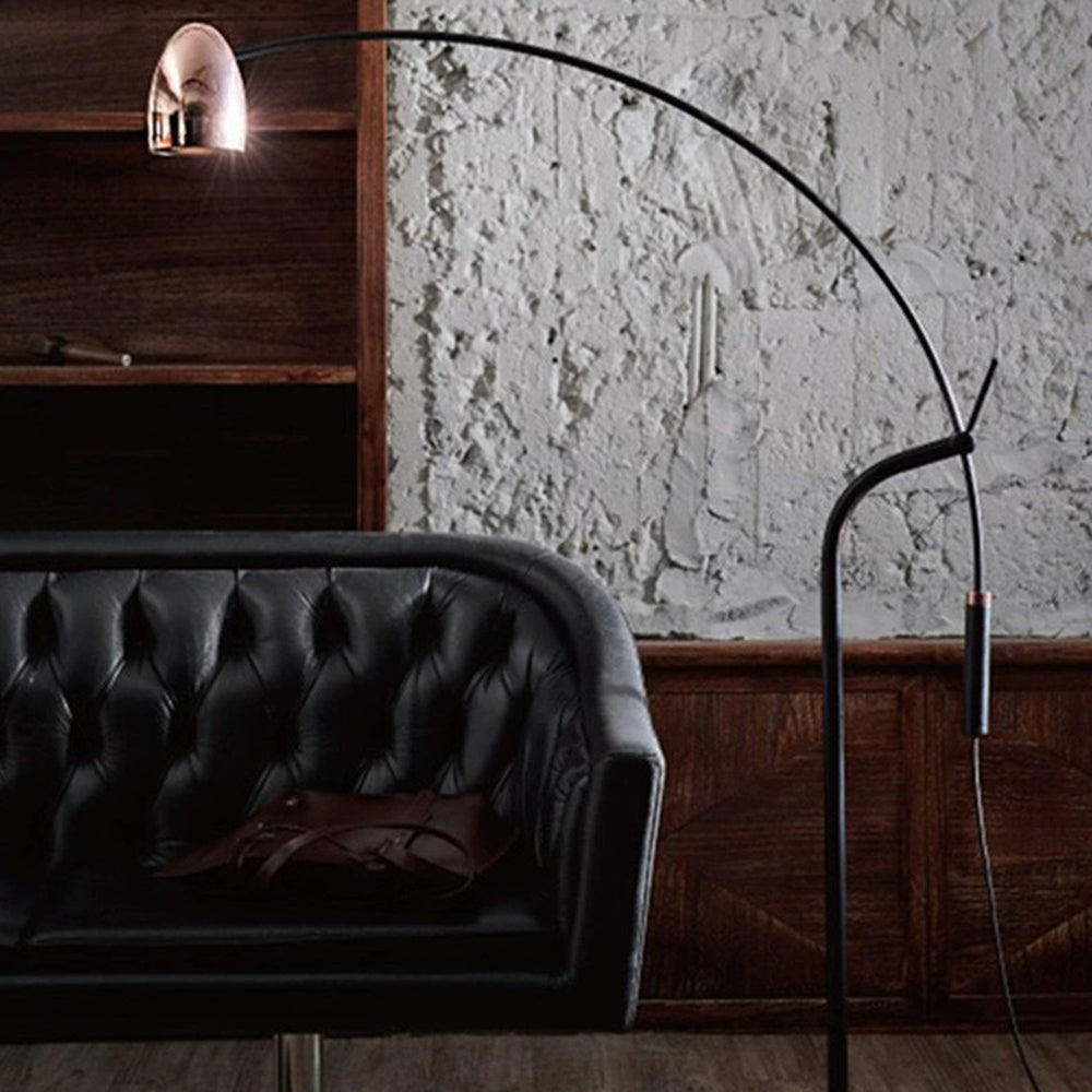 Artistic Minimalist Arc Floor Lamp near leather sofa