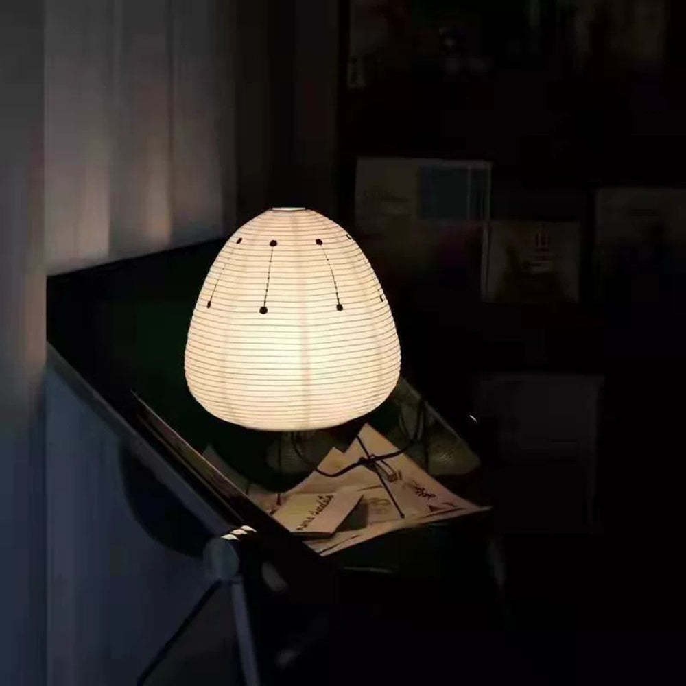 Renée floor lamp illuminating a dark room, paper shade lighting